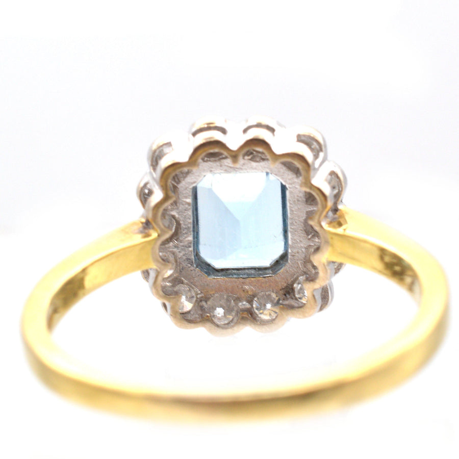 Vintage 18ct gold aquamarine and diamond cluster ring from London, showcasing a stylish design and sparkling stones.