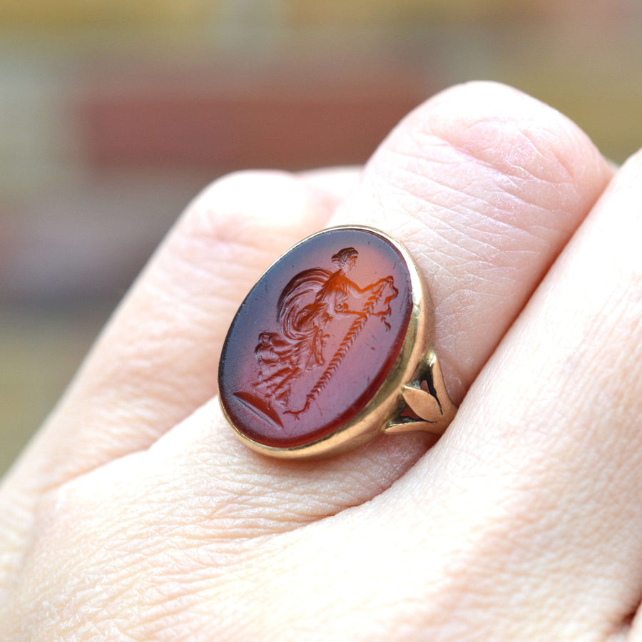 19th century 9ct gold ring featuring carnelian intaglio of Goddess Nike, symbolizing victory.