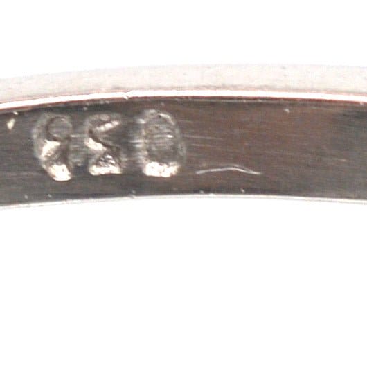 Close-up of the stamp on an American Art Deco platinum ring, showcasing craftsmanship and authenticity.