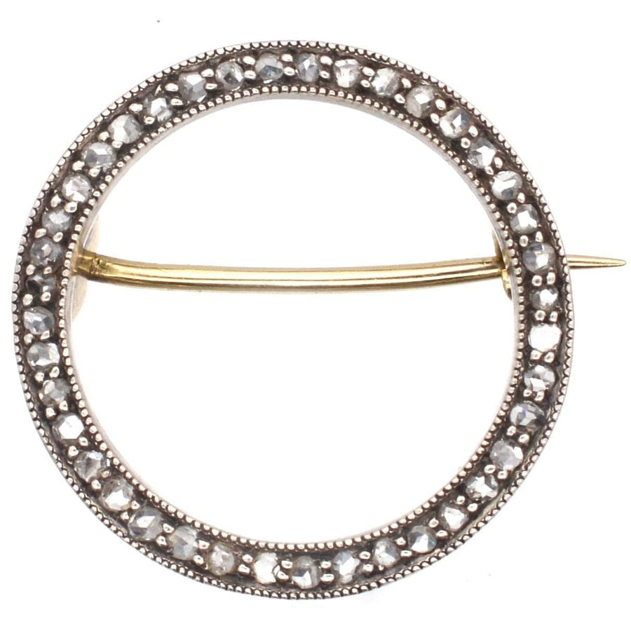 Art Deco 15ct gold and platinum rose diamond circular brooch, featuring intricate design and lustrous rose cut diamonds.