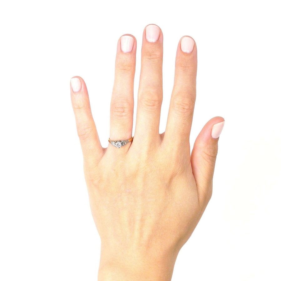 Art Deco 18ct gold diamond solitaire ring worn on hand, showcasing its elegant design and sparkle.