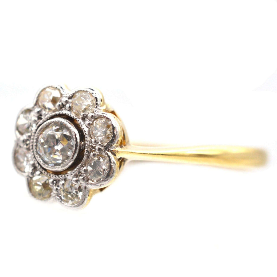 Art Deco 18ct gold and platinum diamond cluster ring with millegrain setting, circa 1920s, 0.10ct center diamond.