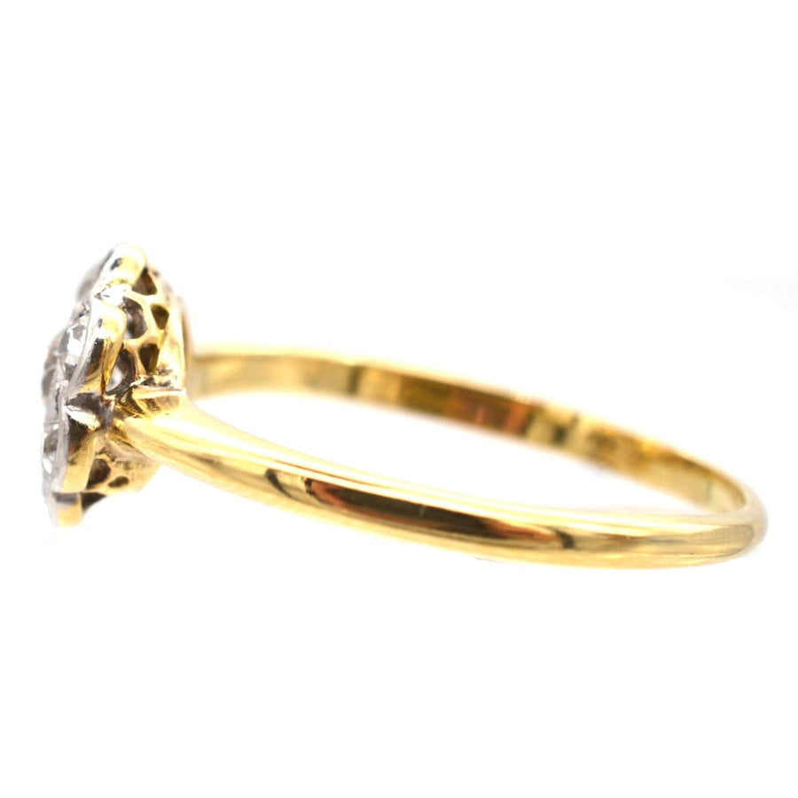 Side view of an Art Deco 18ct gold and platinum diamond cluster ring with 0.20ct center diamond.