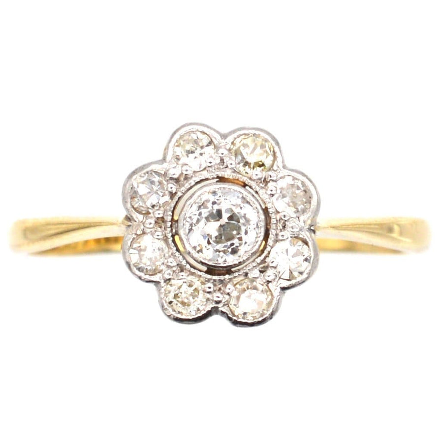 Art Deco 18ct gold diamond cluster ring, featuring a central 0.10 carat diamond with a 0.20 carat halo, circa 1920s.
