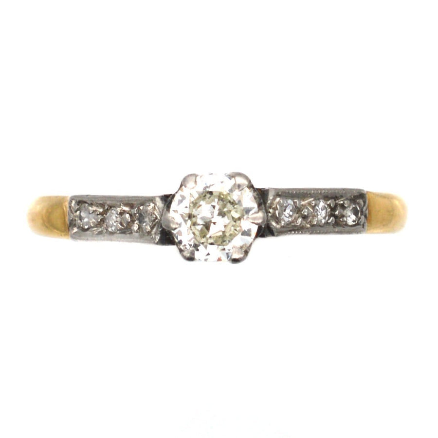 Art Deco 18ct gold and platinum diamond solitaire ring with diamond shoulders, circa 1920s, 0.25 carat central diamond.