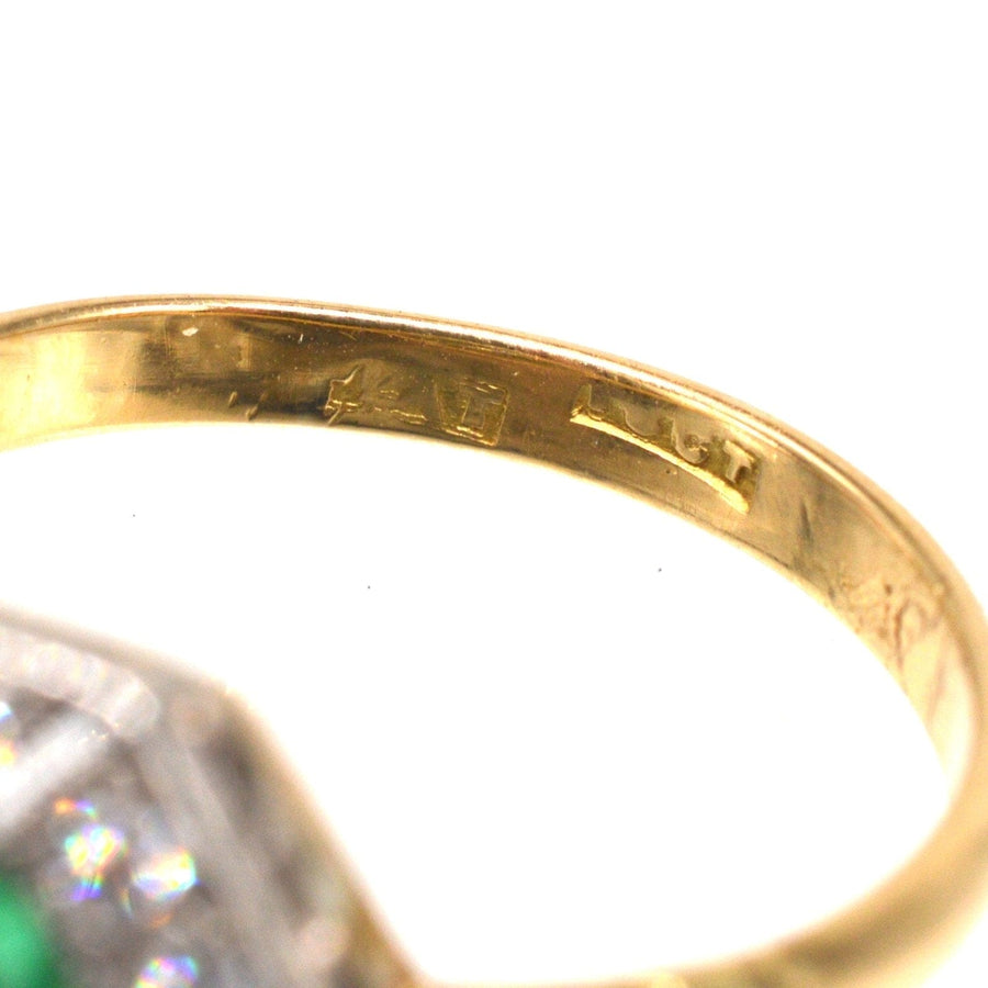 Close-up of the inner band of an Art Deco gold and platinum ring showcasing stamp details.