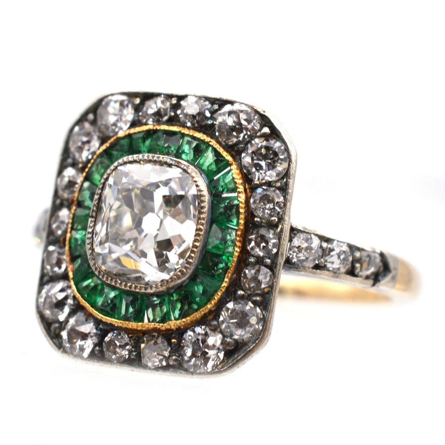 Art Deco 18ct gold and platinum emerald and diamond target ring with old mine cut diamond, ideal for unique engagement.