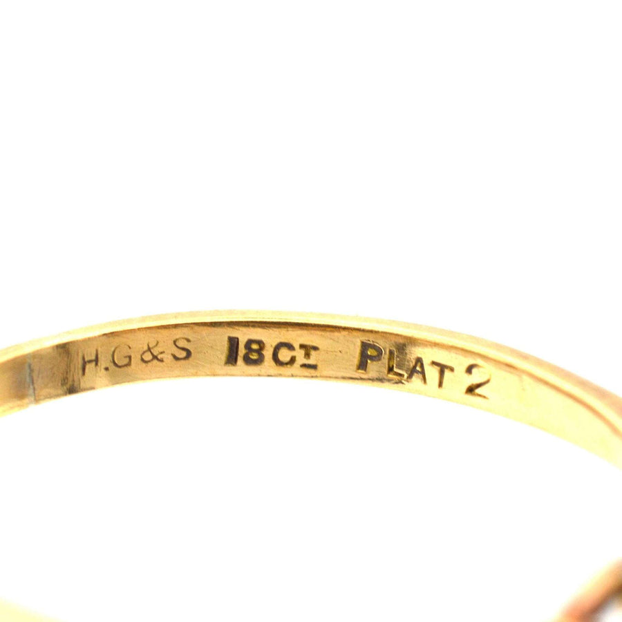 Close-up of the stamp inside an Art Deco 18ct gold and platinum ring by Henry Griffith & Sons.
