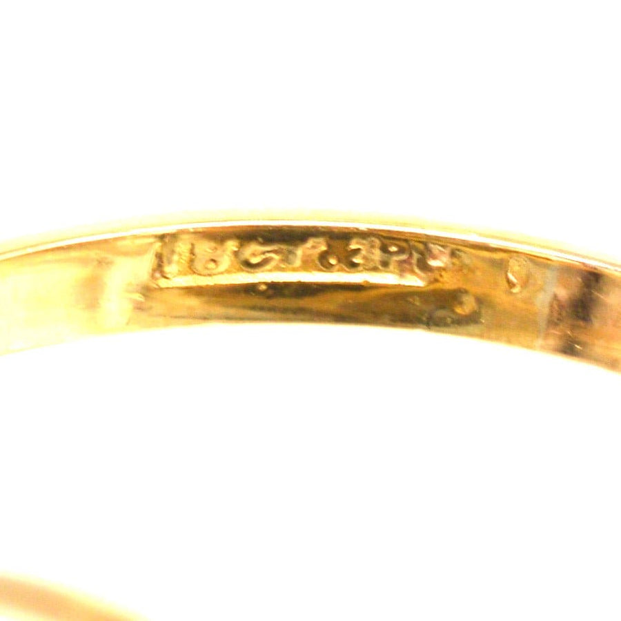 Inside view of an Art Deco gold and platinum ring showcasing its stamp and intricate detailing.