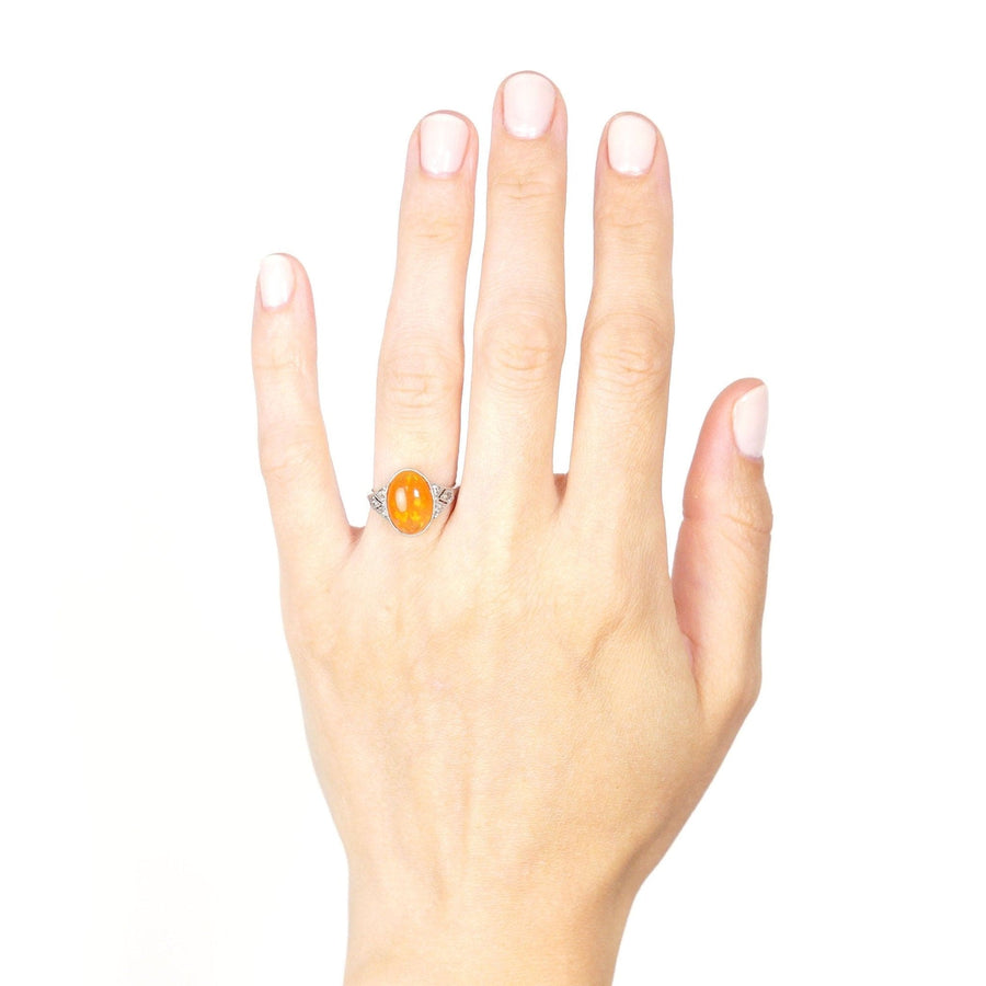 Art Deco 18ct white gold and platinum ring featuring a natural Mexican fire jelly opal on hand.