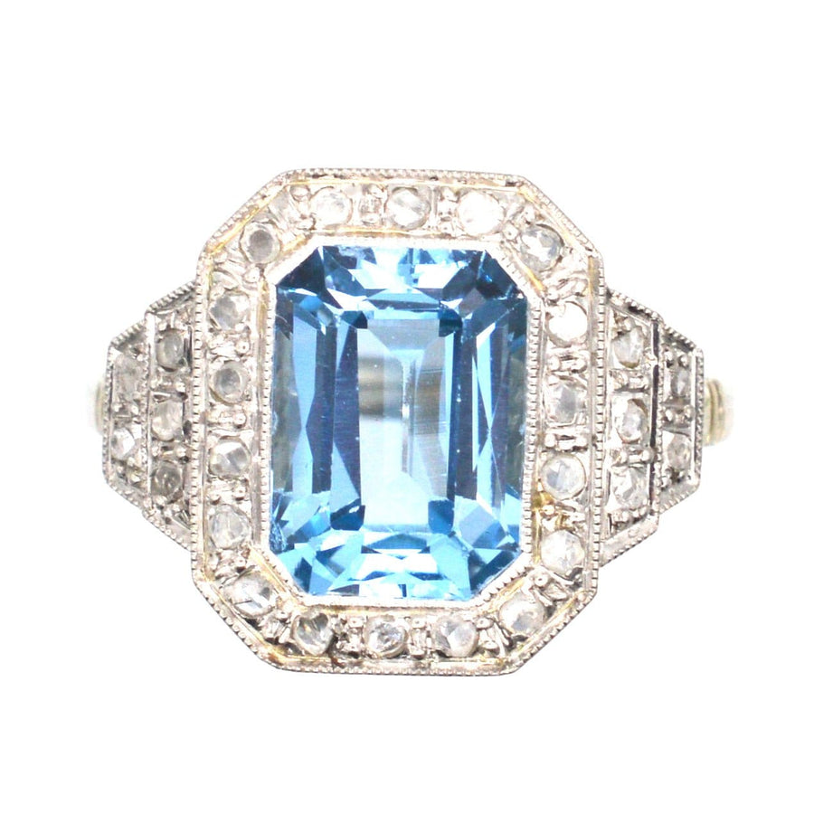 Art Deco blue spinel and diamond ring with elegant octagon design and sparkling shoulders, perfect for engagements or cocktails.