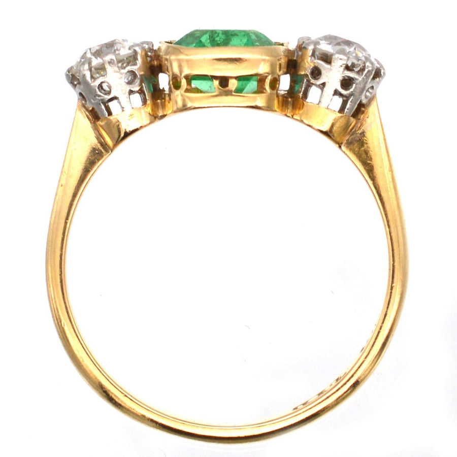 Art Deco platinum and 18ct gold three stone ring with emerald and diamond, perfect for engagement or anniversary.