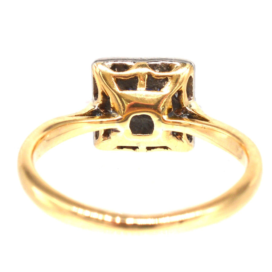 Art Deco platinum and 18ct gold square cluster ring showcasing sapphire and diamond design, perfect for engagement.
