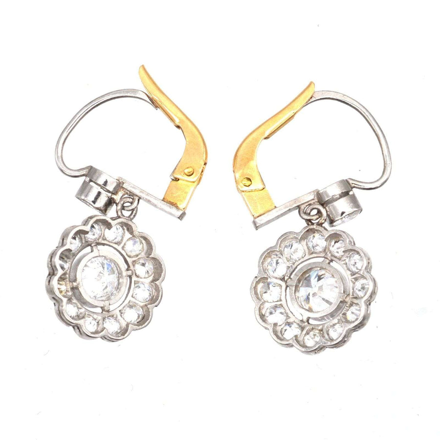 Art Deco platinum and 18ct gold diamond cluster drop earrings featuring 1.25 carats of sparkling white diamonds.