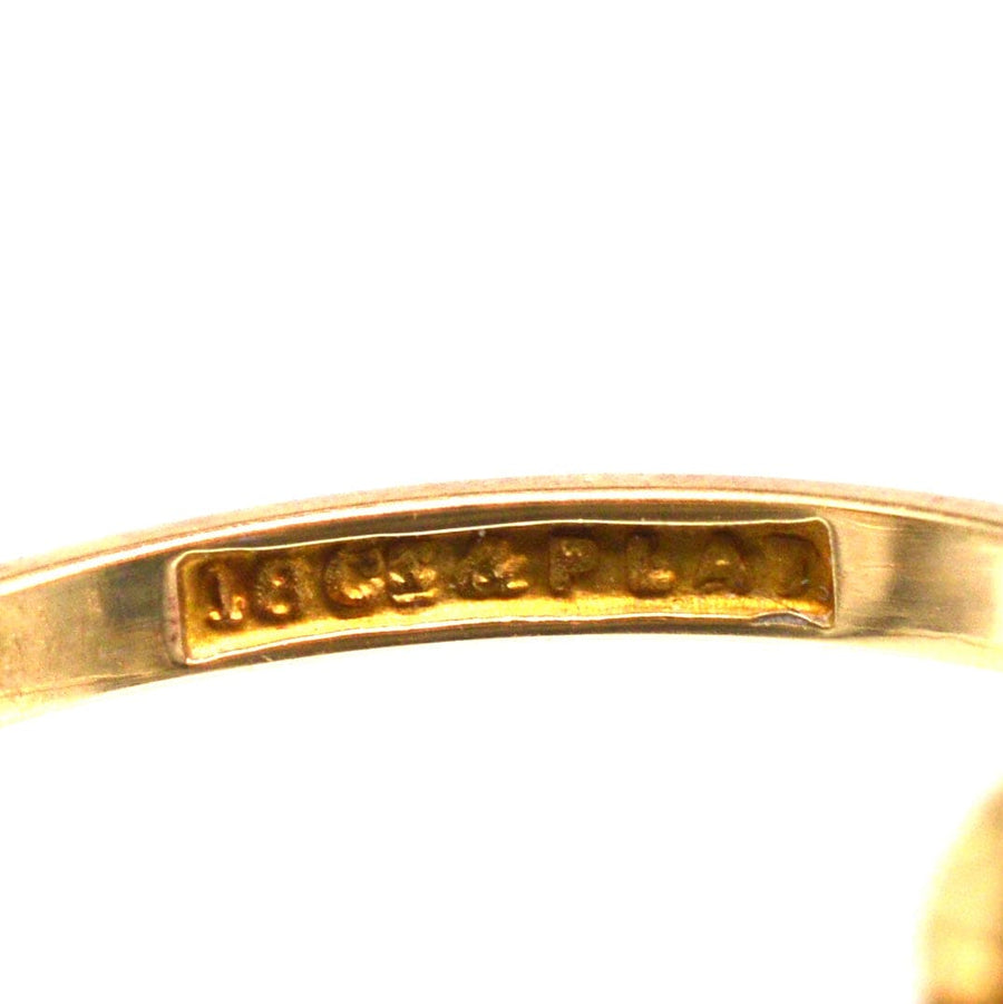 Close-up of the inner band showing the 18ct gold and platinum stamp of the Art Deco sapphire and diamond ring.