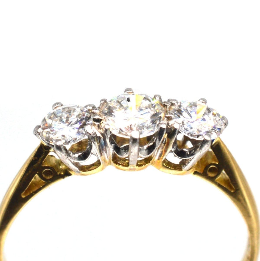 Art Deco platinum and 18ct gold three stone diamond ring with large bright stones, perfect for engagements.