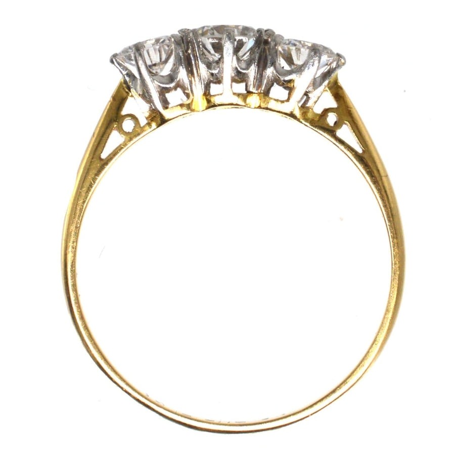 Art Deco platinum and 18ct gold three stone diamond ring, showcasing large bright diamonds in a timeless design.