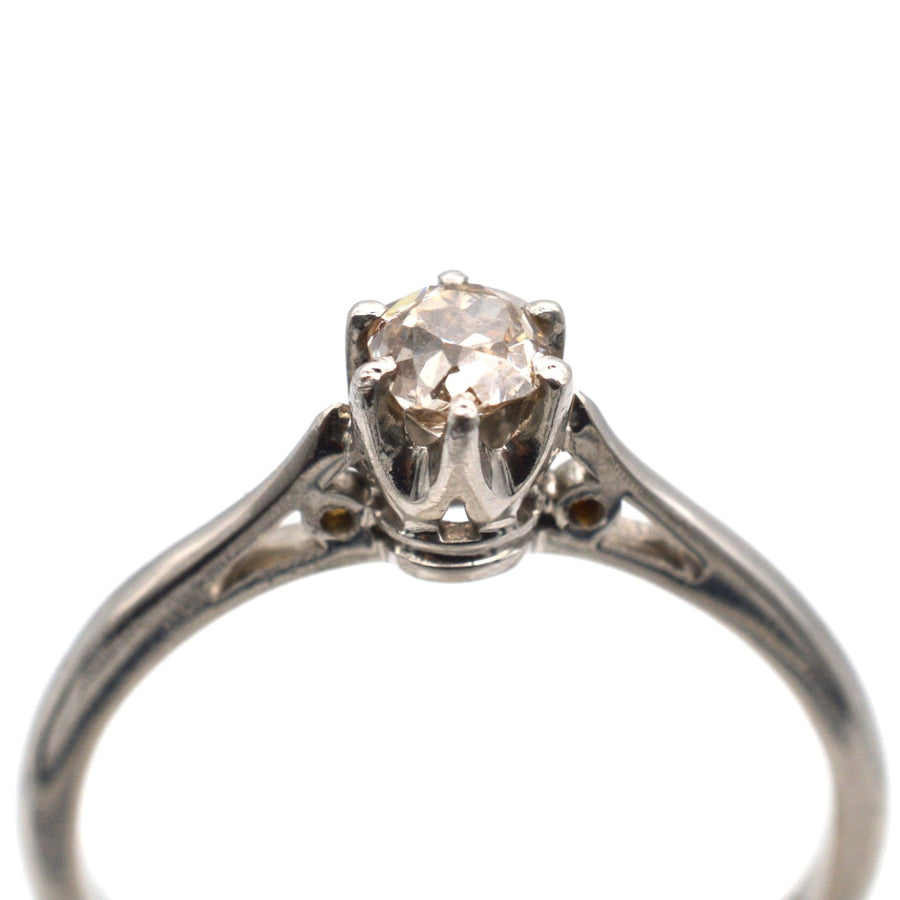 Art Deco platinum solitaire ring featuring an old mine cut cognac diamond, perfect for engagement.
