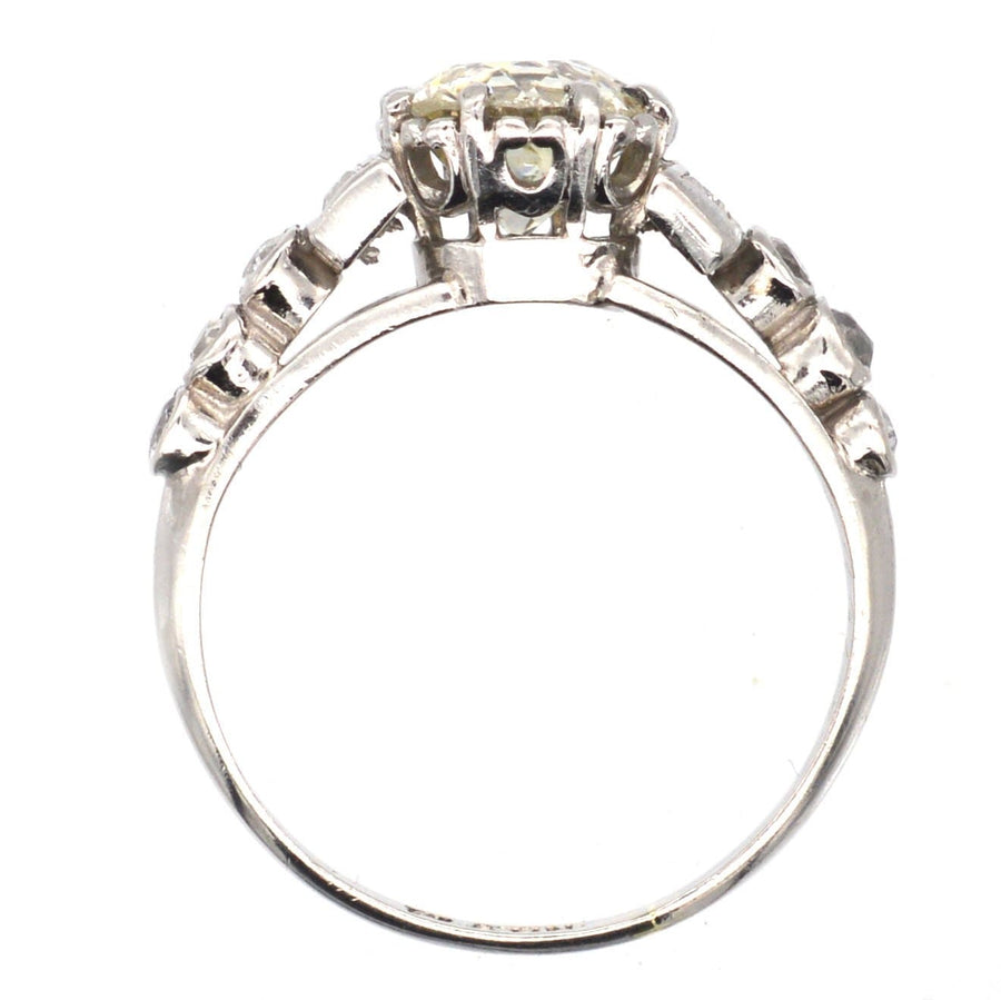 Art Deco platinum large diamond solitaire ring with diamond shoulders, circa 1925, showcasing unique cuts.