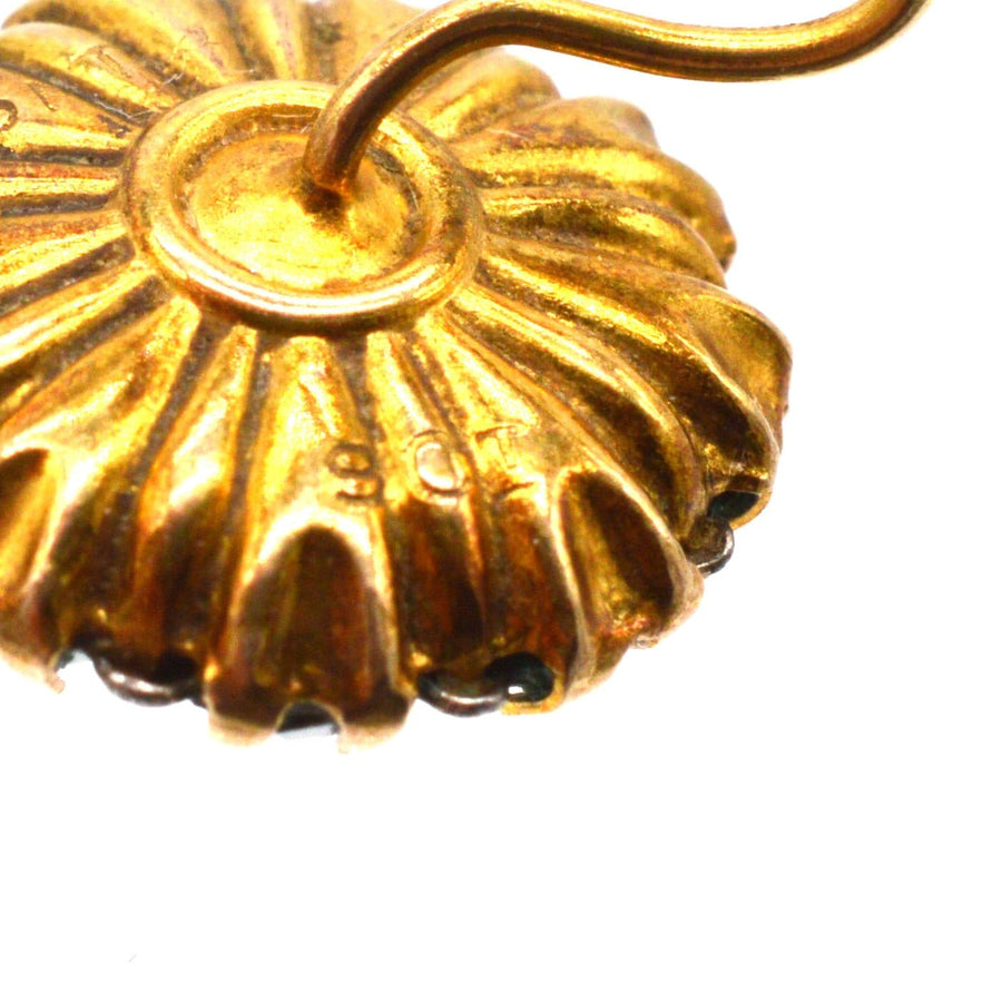 Close-up of Art Deco gold cluster earring, showcasing detailed design and 9ct gold stamp.
