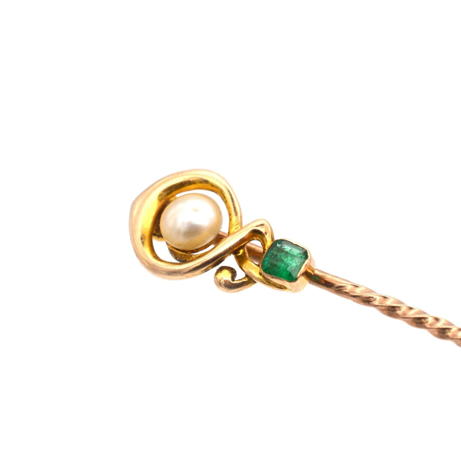 Art Nouveau gold tie pin featuring a lustrous pearl and a natural emerald, perfect for colorful silk ties.