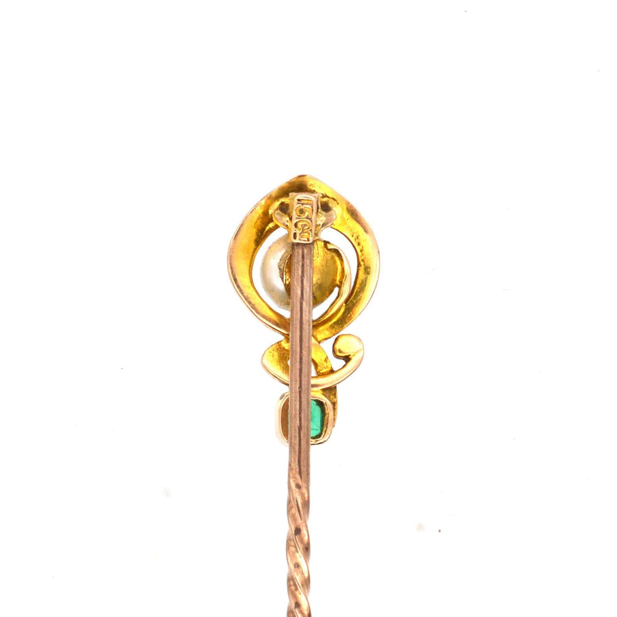 Art Nouveau 15ct gold tie pin with emerald and pearl, featuring a unique, musical design.