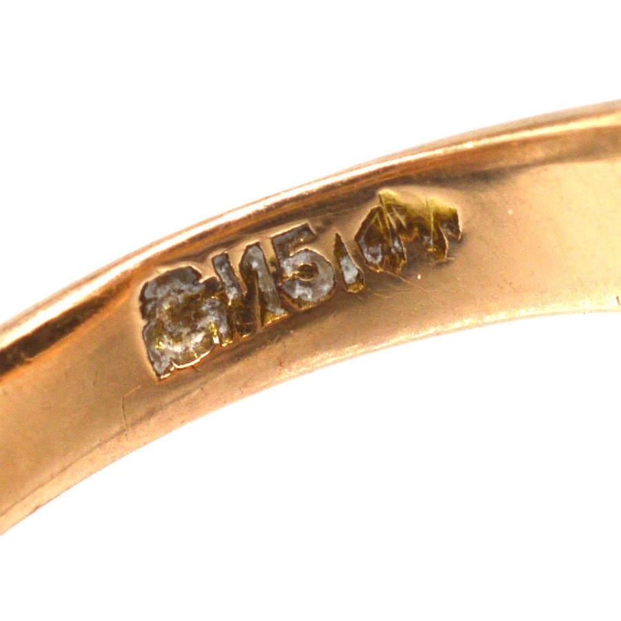 Close-up of the stamp on an Edwardian 15ct Gold ring, showcasing the quality and authenticity of the jewelry.