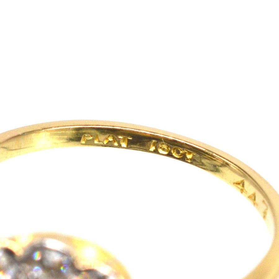 Close-up of an Edwardian 18ct gold and platinum ring showcasing the inner stamp.