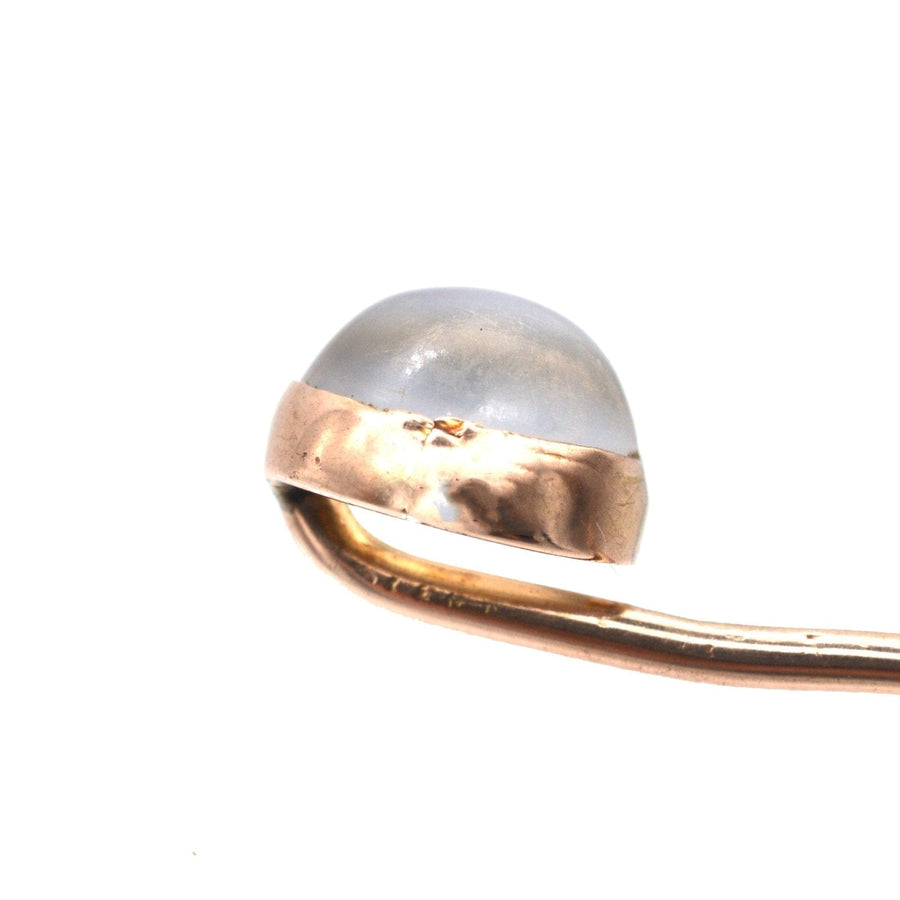 Close-up of an Edwardian 18ct gold tie pin featuring a moonstone, showcasing its unique bluey gray sheen.