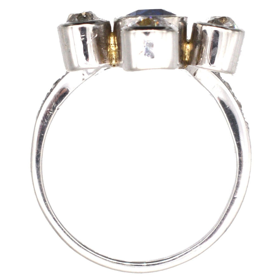 Edwardian 18ct white gold duchess tiara ring featuring a central sapphire and diamond accents, showcasing vintage elegance.