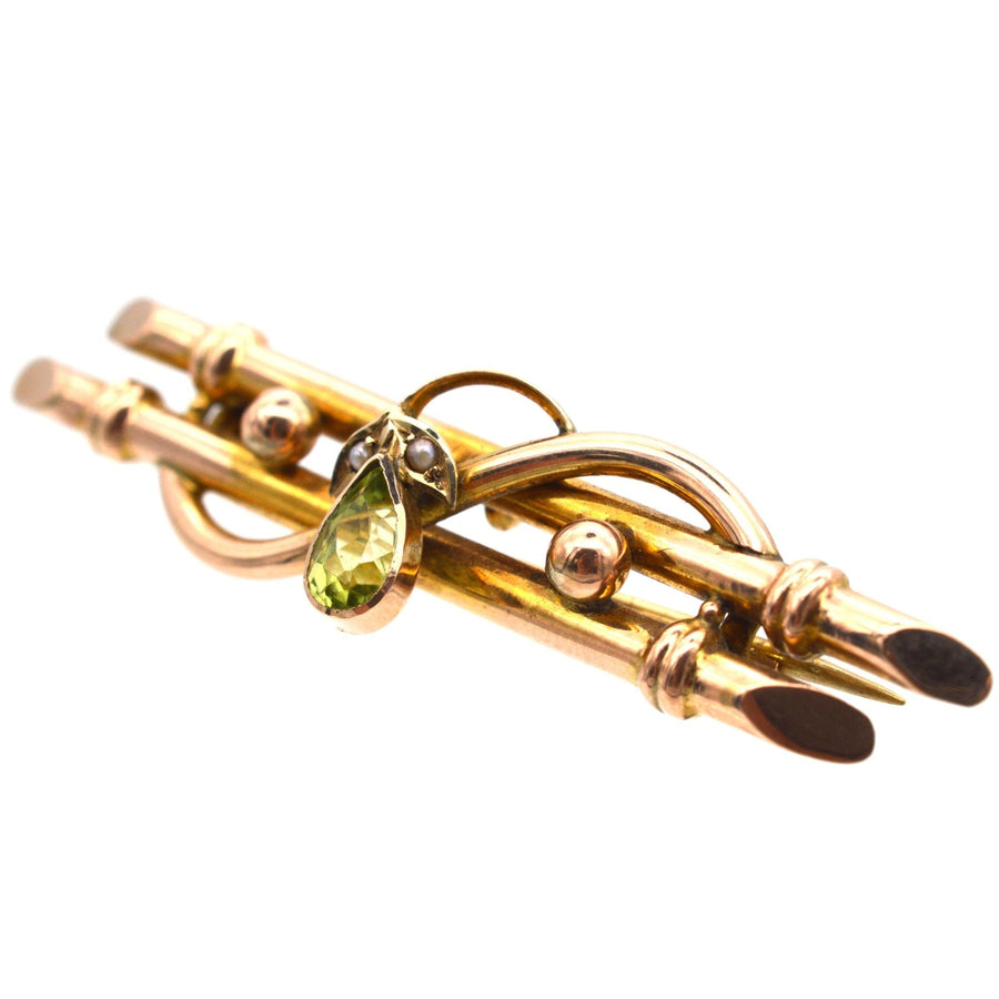 Edwardian 9ct gold bar brooch with pear shape peridot and seed pearls, elegant floral design circa 1900-1910.