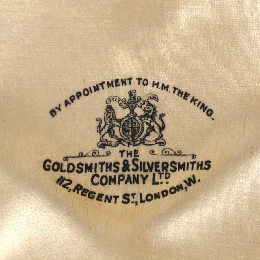 Goldsmiths & Silversmiths Company logo, royal warrant, silk lining, vintage jewelry box design, London.
