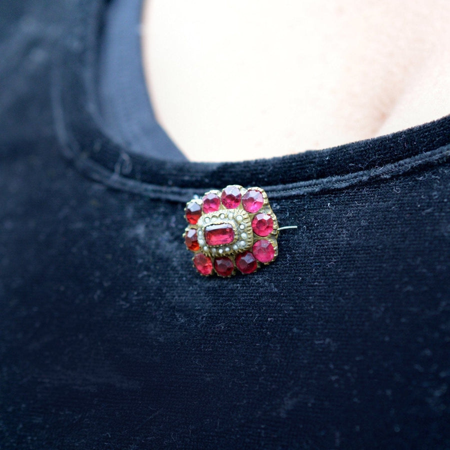 Georgian red paste 'Garnet' brooch showcasing vibrant gemstones on a velvet background.