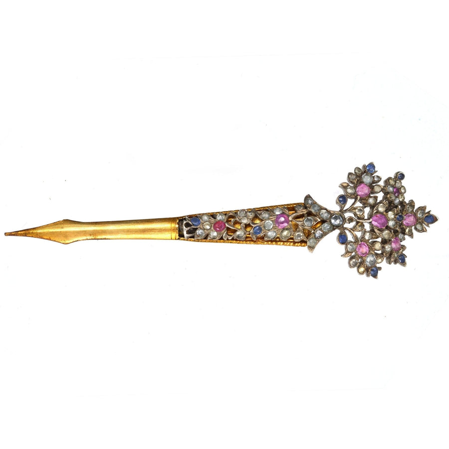 Late 19th century Sri Lankan kondakoora hairpin with sapphires and zircons, featuring an ornate boteh finial.