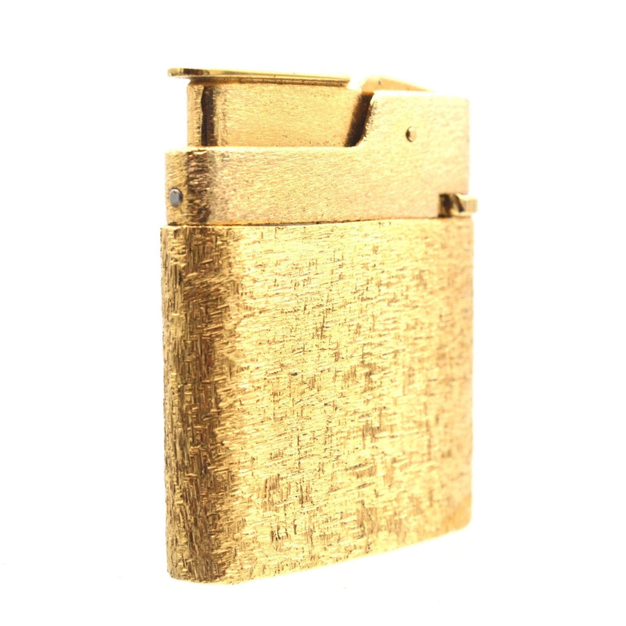 Vintage gold lighter from Mid Century Norman Hartnell jewelry set, stylish design, unique collectible accessory.