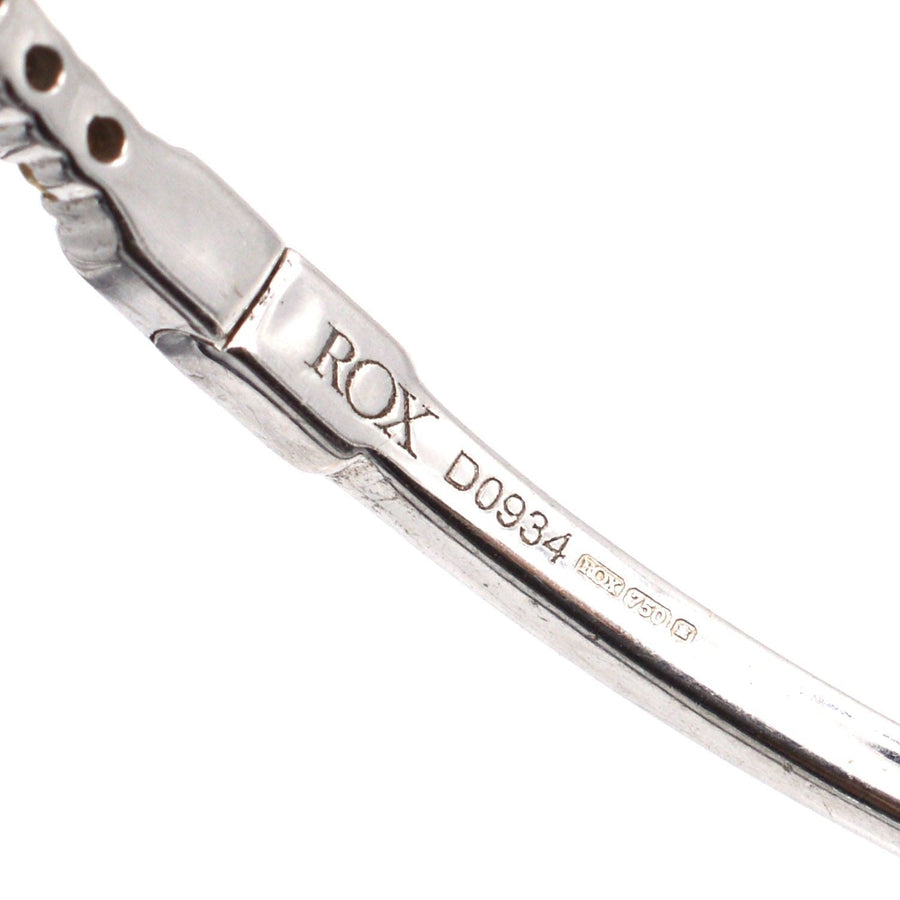 18ct white gold diamond bangle showcasing stamp and detail, perfect for gifting or stacking with other jewelry.