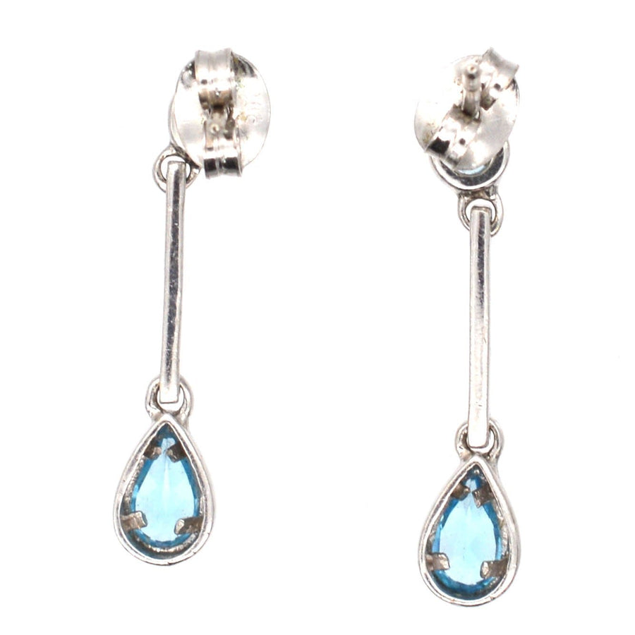 Modern 9ct white gold earrings featuring blue spinel pear drop design, elegant and comfortable for day-to-night wear.