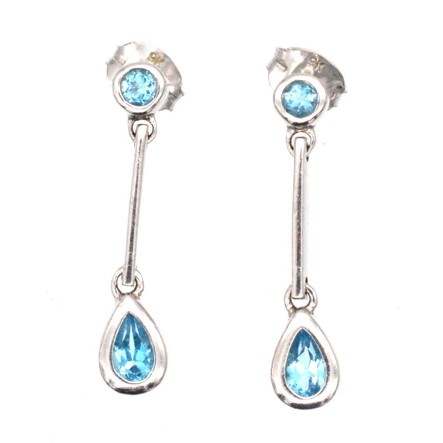 Modern 9ct white gold blue spinel pear drop earrings, elegant and comfortable for day-to-night wear.