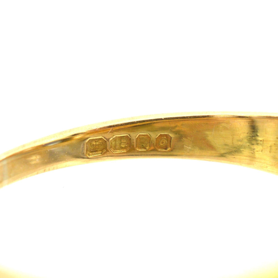 stamp details on an 18ct gold Victorian-style sapphire and diamond ring, showcasing quality craftsmanship.