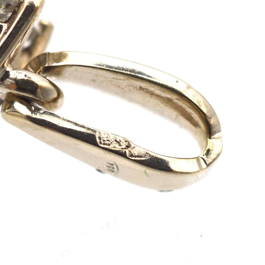 Close-up of vintage 18ct white gold pendant setting with visible stamp details.
