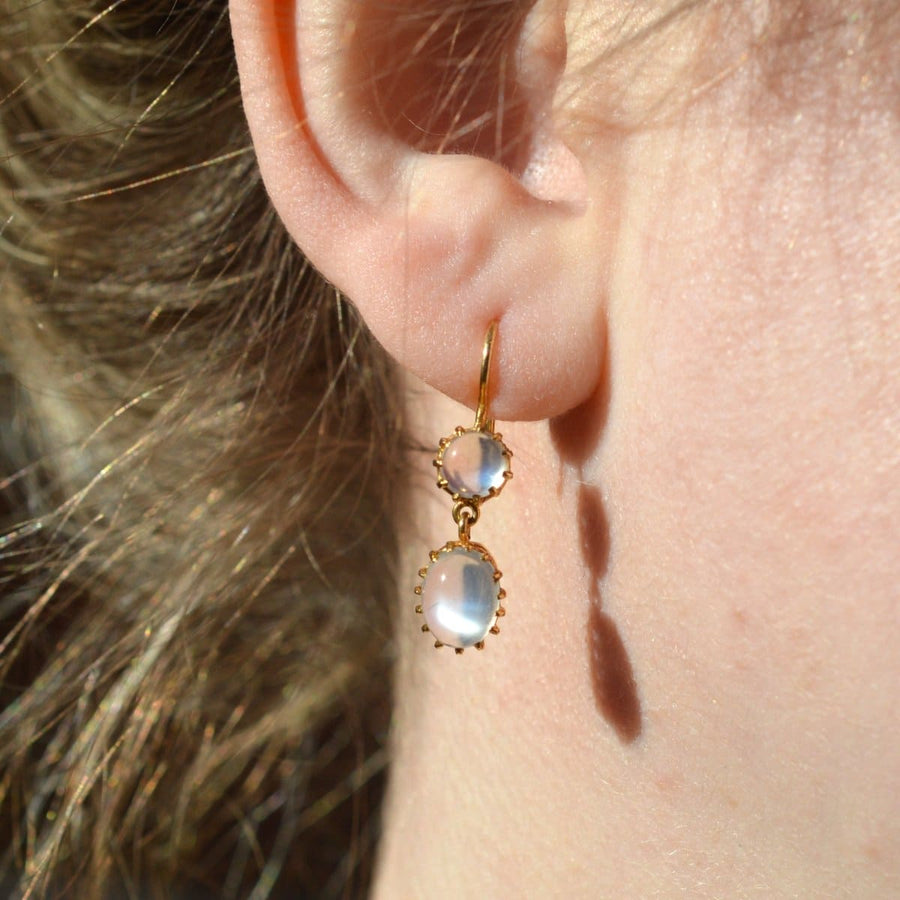 Vintage 9ct gold moonstone drop earrings with round and oval moonstones displaying gray/blue flashes.