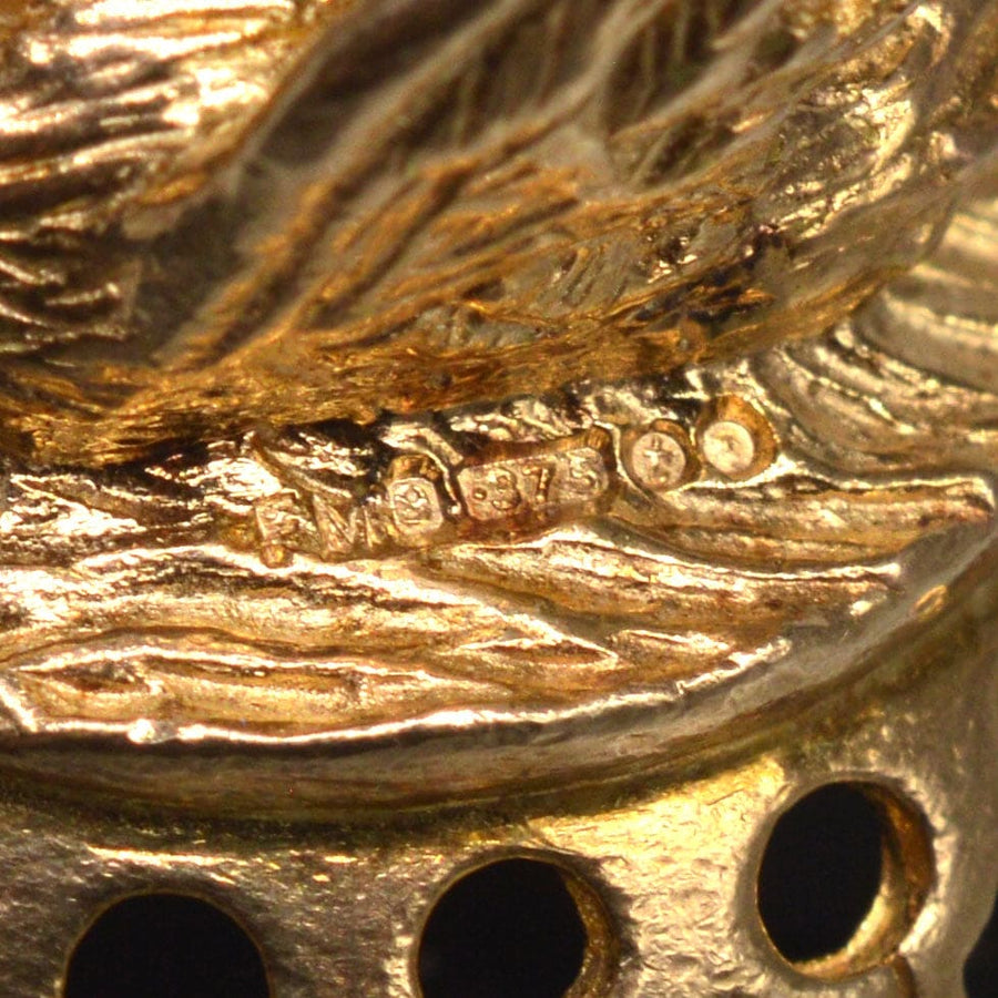 Close-up of stamp on Vintage 9ct Gold Swan Pendant, showcasing craftsmanship and quality of 9ct gold.