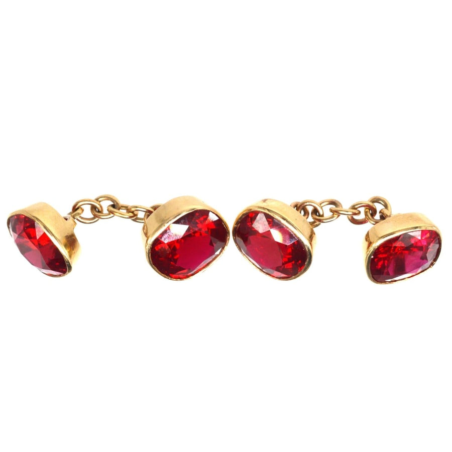 1940s 9ct gold cufflinks featuring vibrant red paste stones, elegantly designed for a stylish shirt cuff.