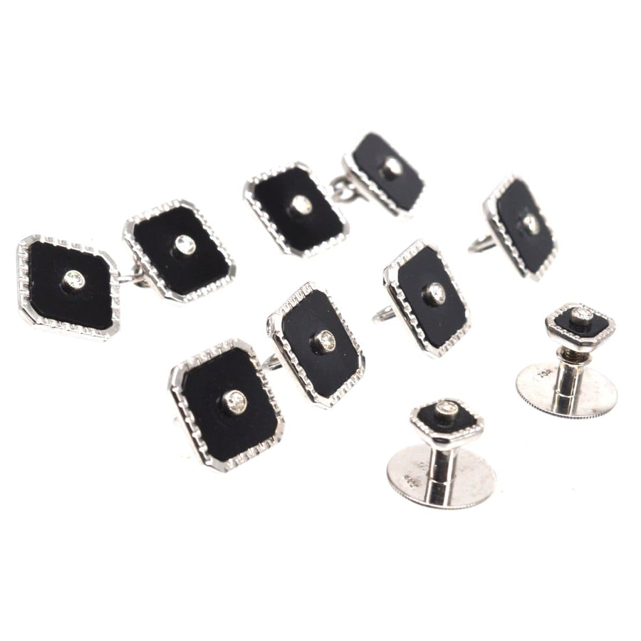Art Deco 9ct white gold dress set with onyx and diamond cufflinks in elegant display.