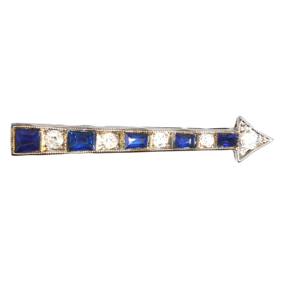 Art Deco French sapphire and diamond arrow brooch, featuring stylish blue sapphires and sparkling diamonds.
