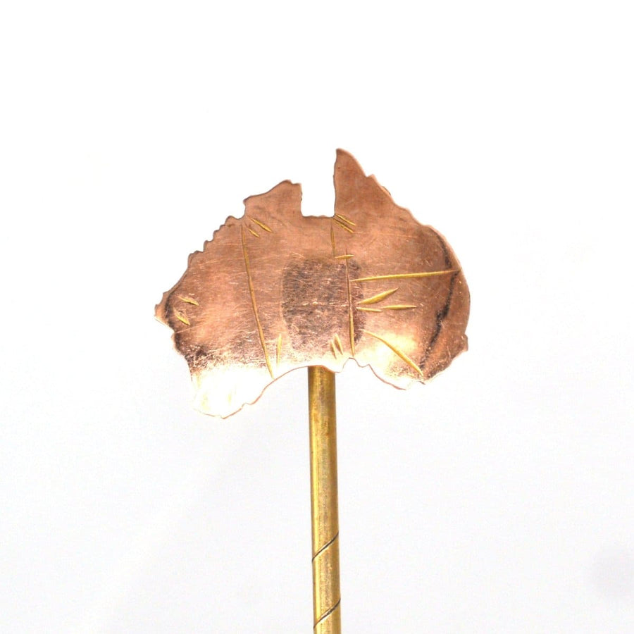 Early 20th century 9ct gold tie pin shaped like Australia, showcasing its 6 states, a perfect souvenir from down under.