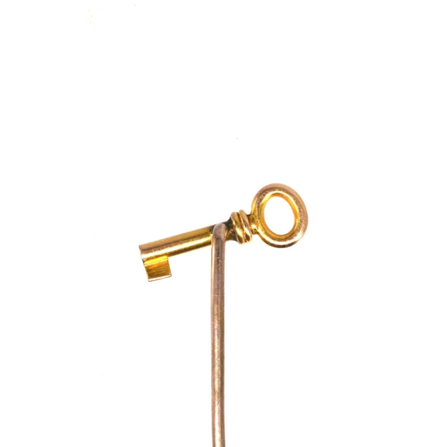 Edwardian 15ct gold tie pin designed as a key, symbolizing love, new beginnings, and success. Beautiful vintage accessory.