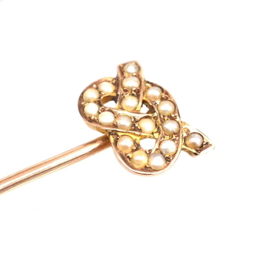 Edwardian 15ct gold Stafford knot tie pin adorned with natural split pearls, showcasing a vintage accessory design.