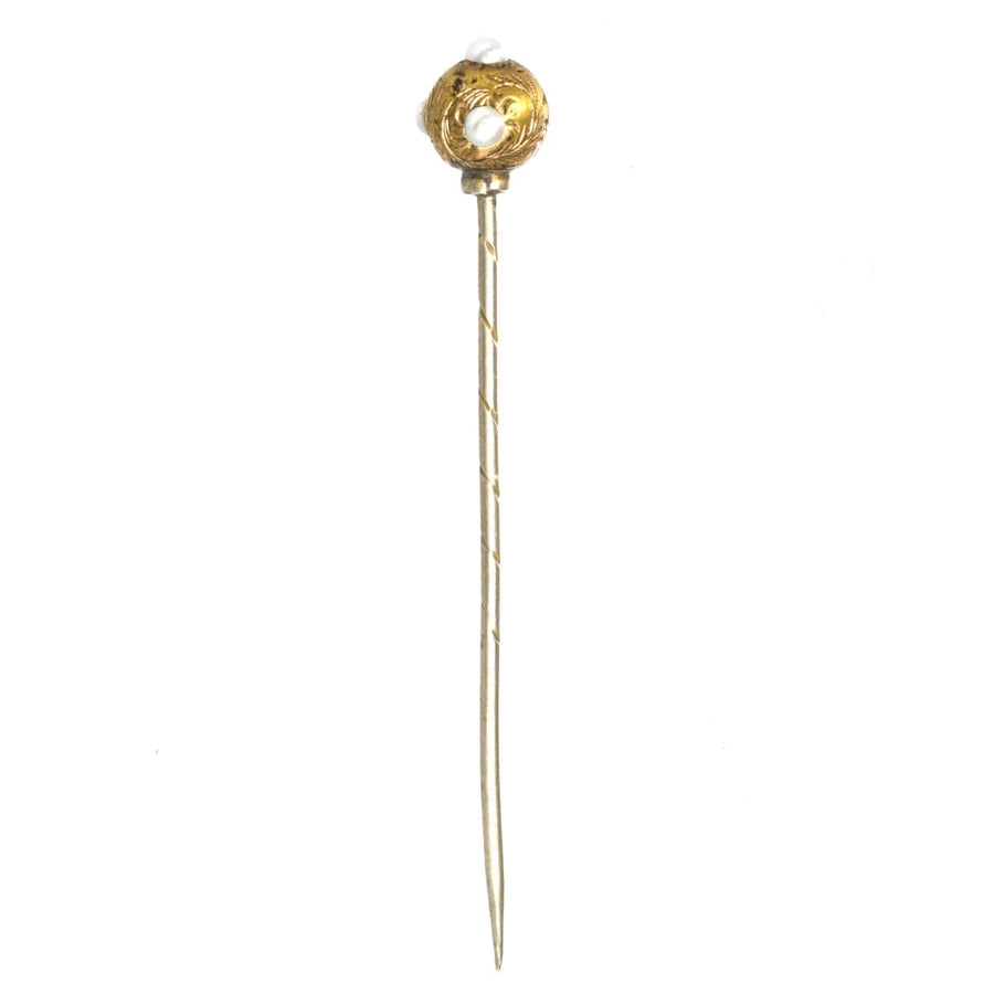 Regency pearl and gold ball tie pin from the 1820s-1840s, featuring engraved swirling leaves and a classic design.