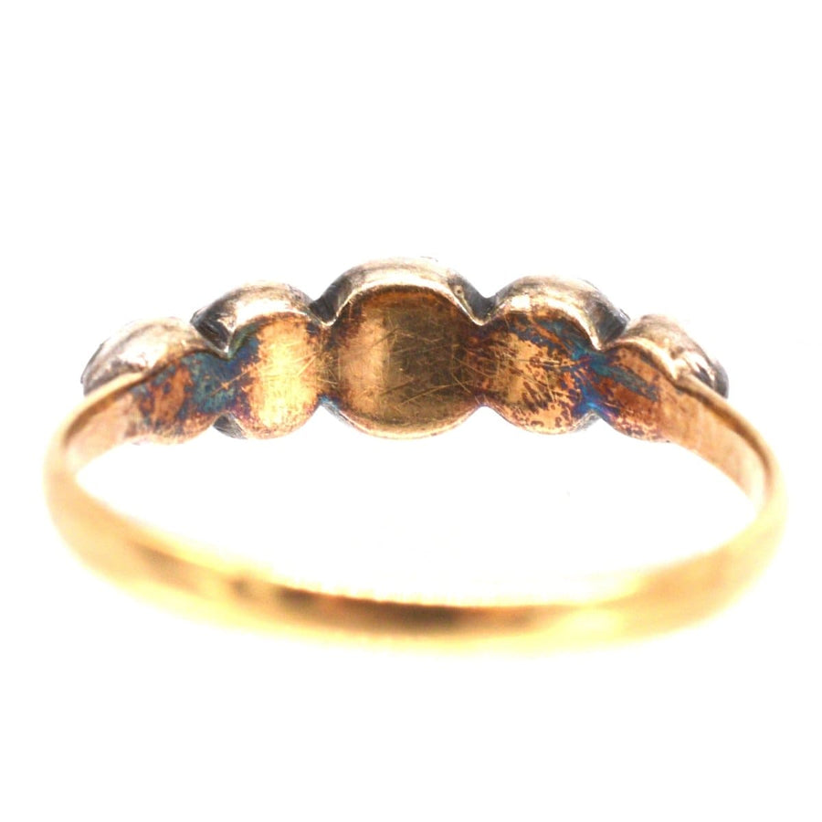Regency five stone rose cut diamond ring, showcasing a unique antique design in silver and gold.